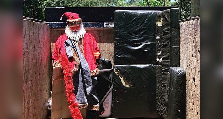 large Santa statue inside a 1-800-GOT-JUNK? truck