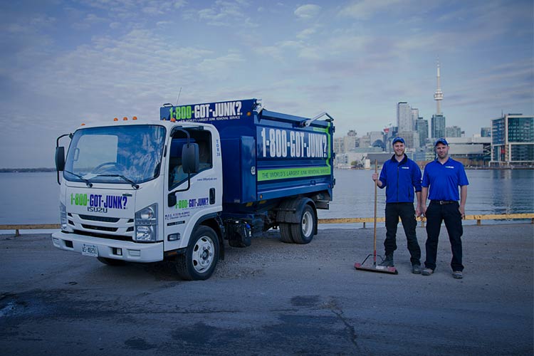 1-800-GOT-JUNK? Toronto team next to junk removal truck