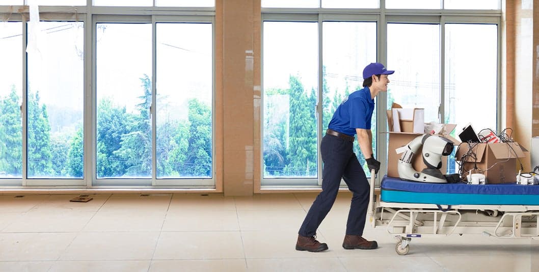 team member removing junk from healthcare facility