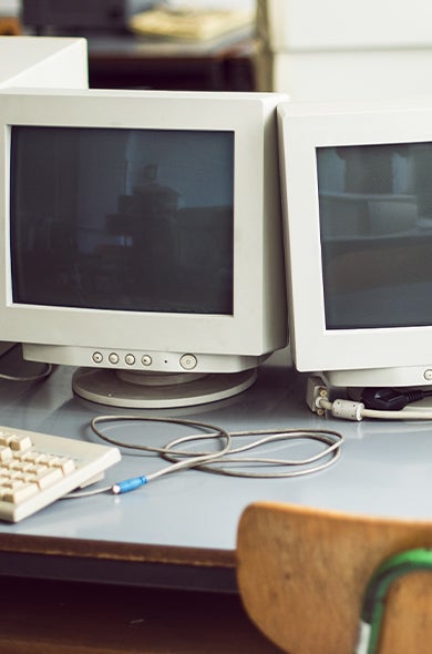 Old, boxy computers ready for computer recycling