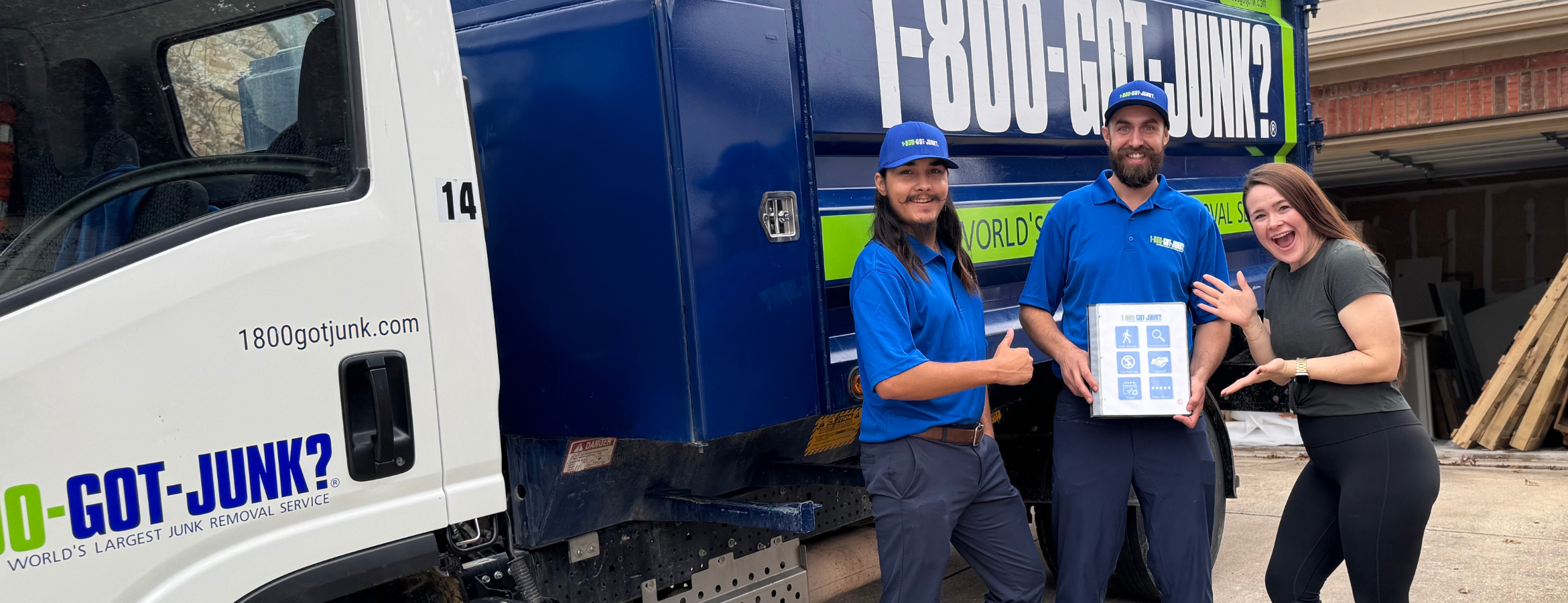 Renovation DIY influencer Ruth Largaespada smiling and posing with 1-800-GOT-JUNK? team beside a junk removal truck