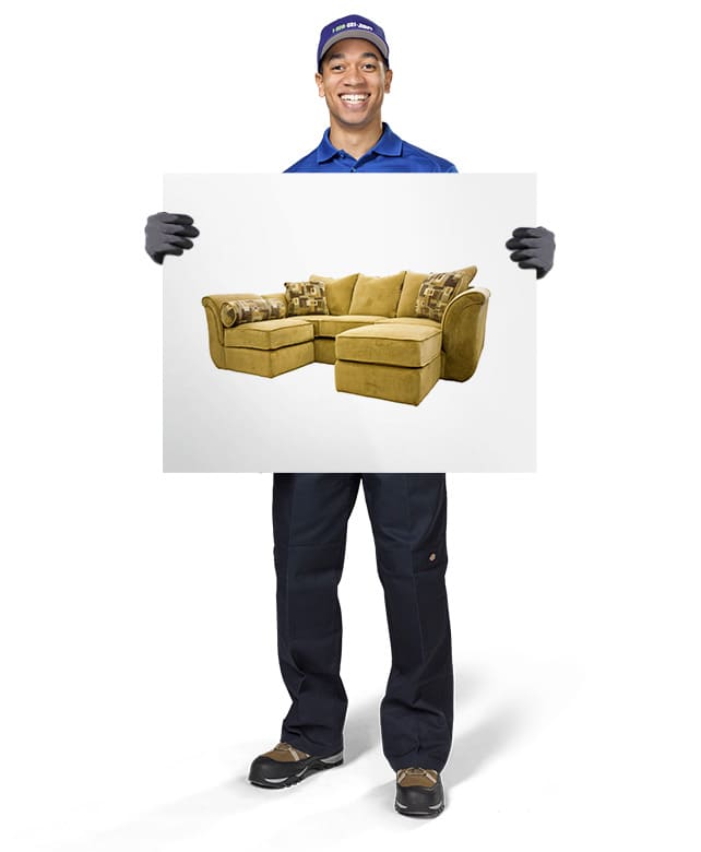 1-800-GOT-JUNK? Truck Team Member holding an image of a sectional couch