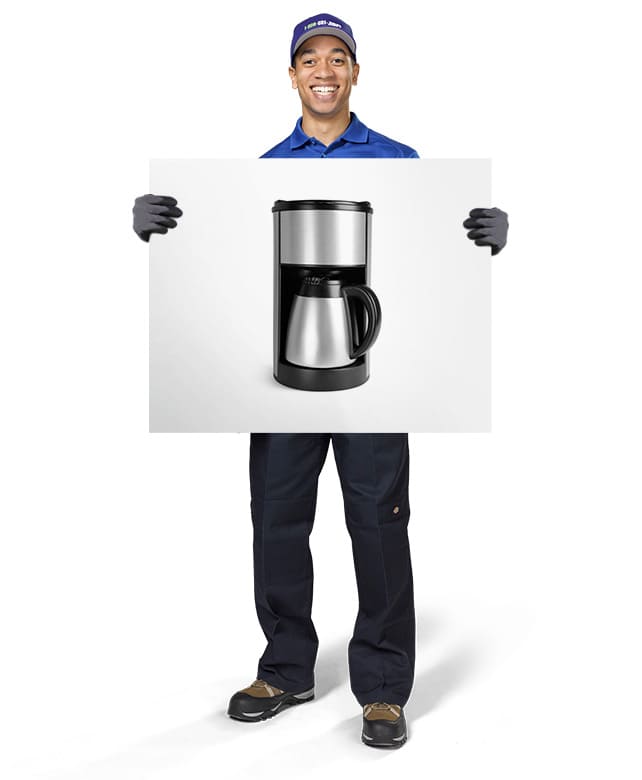1-800-GOT-JUNK? Truck Team Member holding an image of a coffee machine