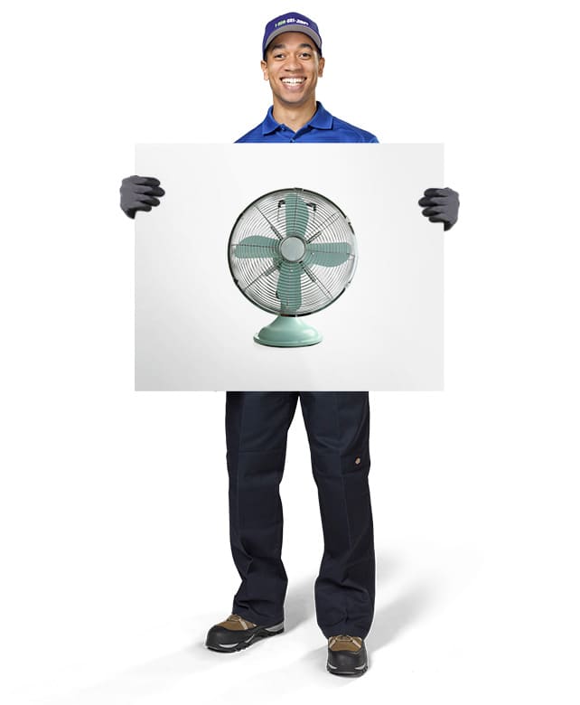 1-800-GOT-JUNK? Truck Team Member holding an image of a fan