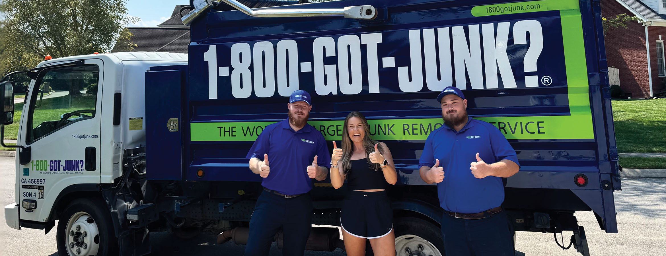 Laura Elizabeth Graham with two 1-800-GOT-JUNK? Truck Team Members in front of a 1-800-GOT-JUNK? Laura Elizabeth Graham with two 1-800-GOT-JUNK? Truck Team Members in front of a 1-800-GOT-JUNK?