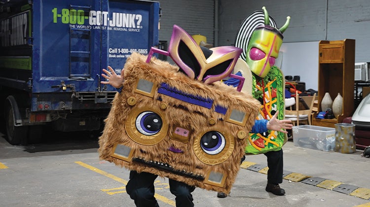 1-800-GOT-JUNK? Team member wearing a furry boombox custom