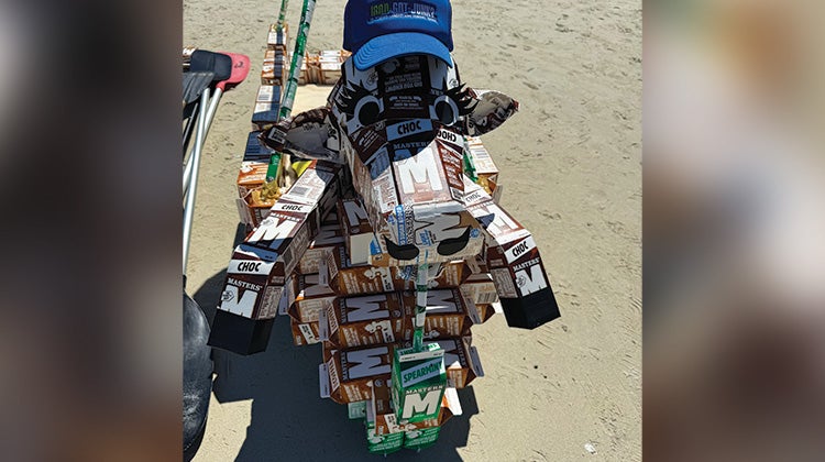 Cow statue made of milk cartons