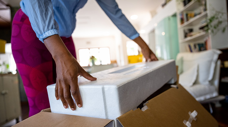 Woman-unpacking-large-box-with-polyester-protective-packaging-post-image.jpg