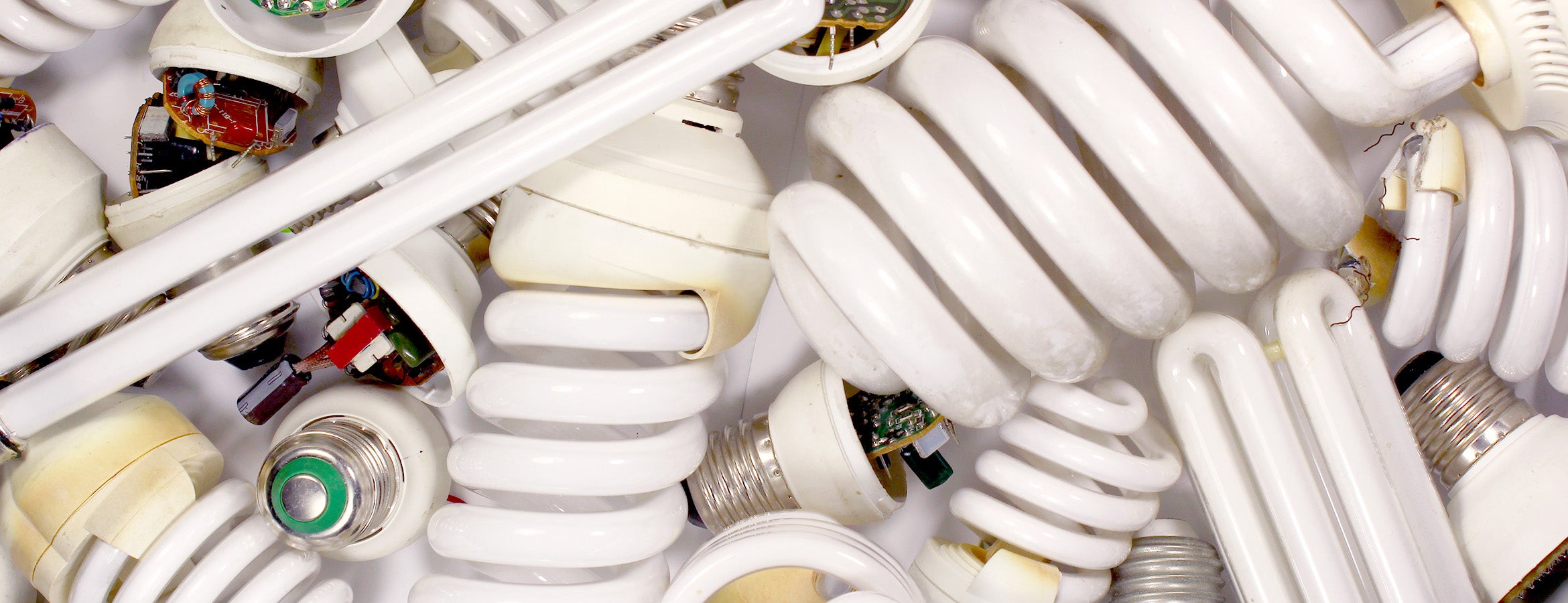 Pile of used fluorescent light bulbs