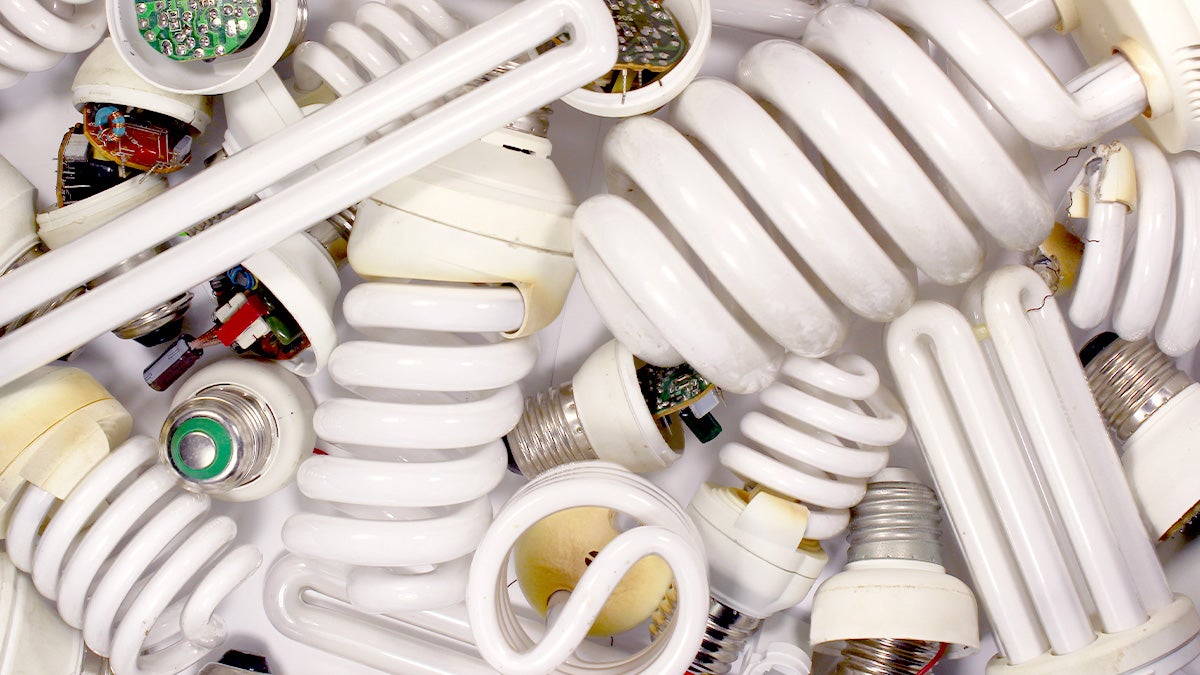 Pile of used fluorescent light bulbs