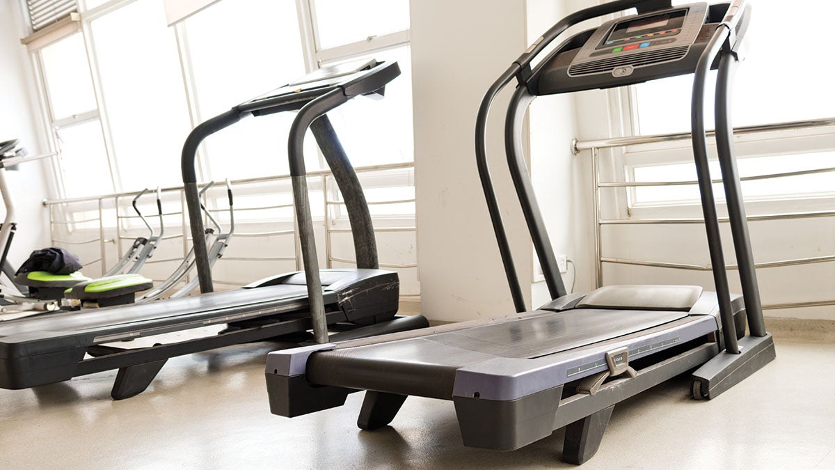 old treadmills against a window